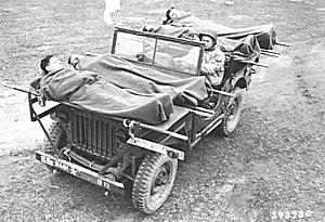 Using metal rails, four casualties could be loaded onto a jeep.