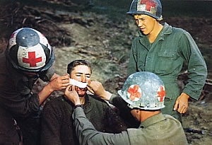 Medics from the 10th Mountain Division, demonstrating the mix of helmet insignia.